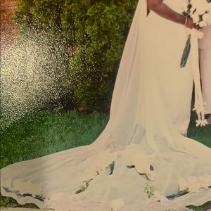 Ivory beaded A-Line wedding gown. Detachable long sheer neck train